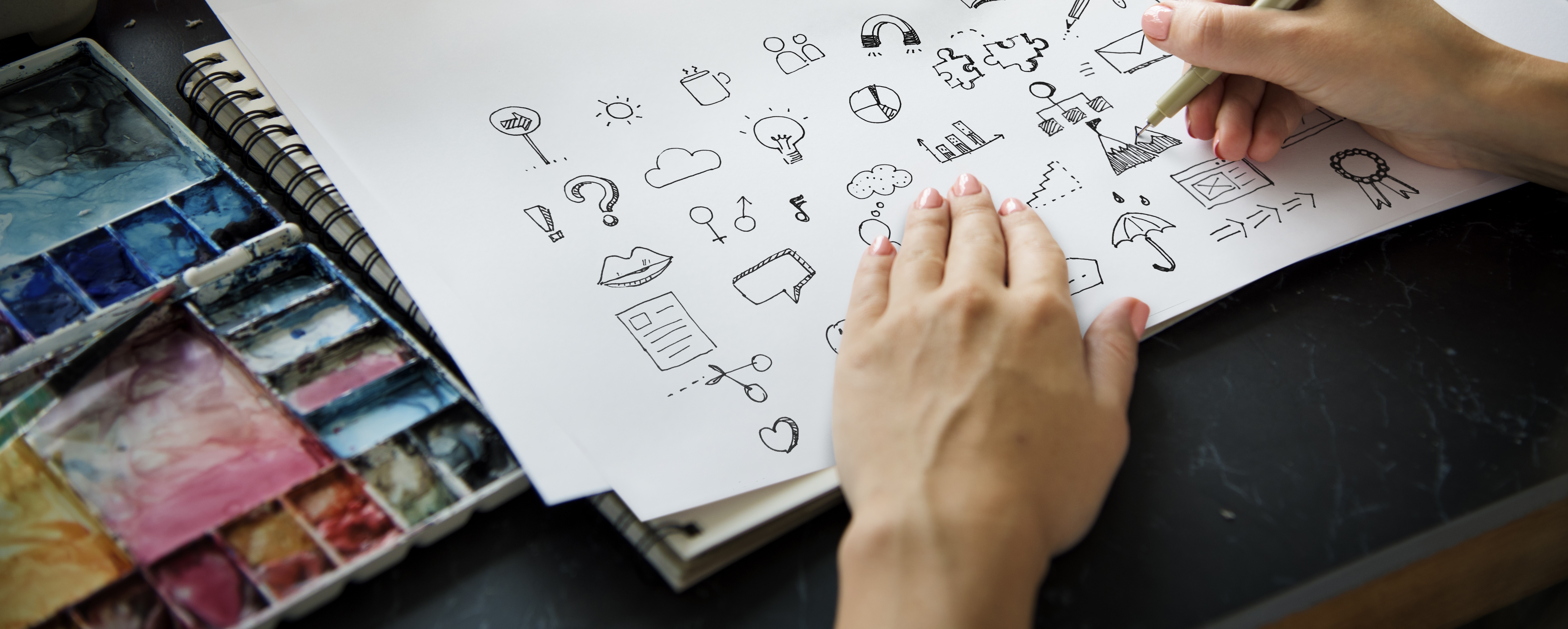 A designer creating icon design concepts