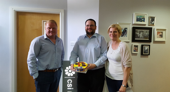 Adam, one of our Web Developers, celebrates 10-years at CSI Media with a cake