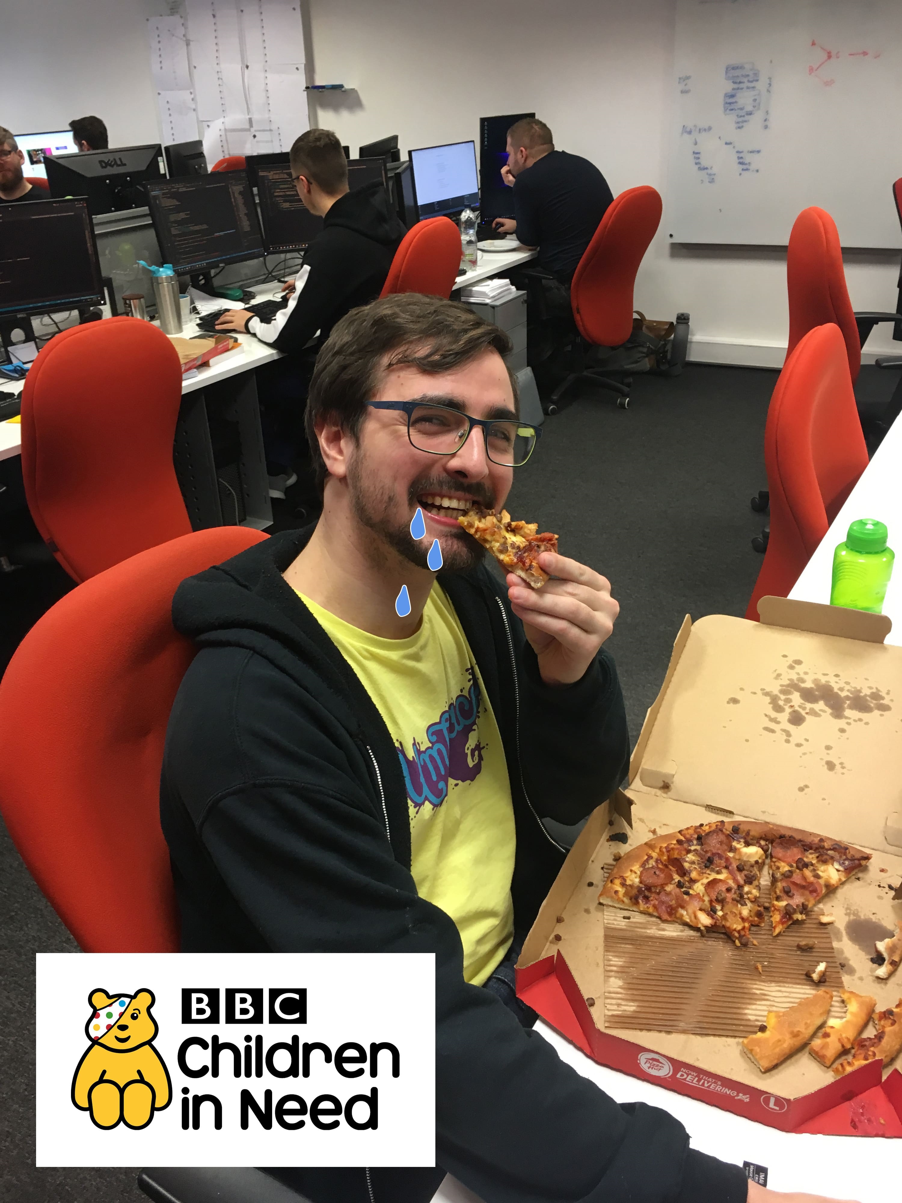Tom eating pizza at CSI Media's Children in Need event